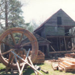 The completed waterwheel sits in the yard of Yates Mill waiting for restoration work to finish in 1995.